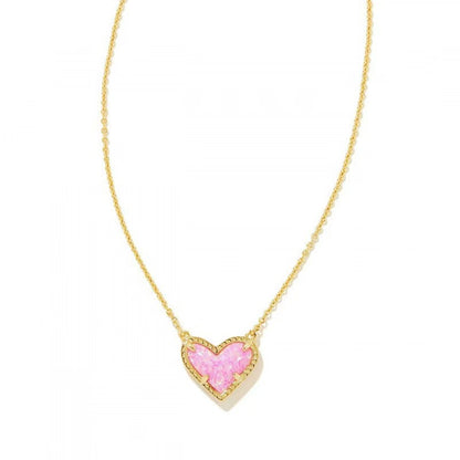 Cubic Zirconia Heart Pendant Necklace in gold-tone with pink heart charm on delicate chain.
