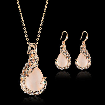 Bridal peacock gem necklace and earrings set in gold-tone with peach cabochons and clear crystals