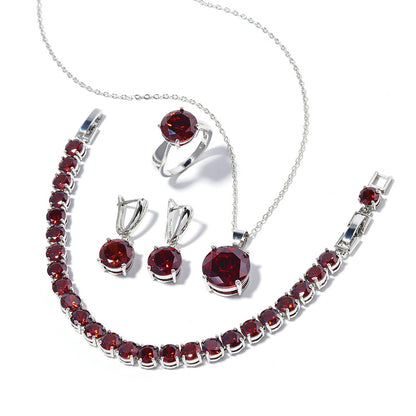 Geometric round jewelry set in silver-tone with red gemstones, including necklace, bracelet, ring, and earrings (4-piece)