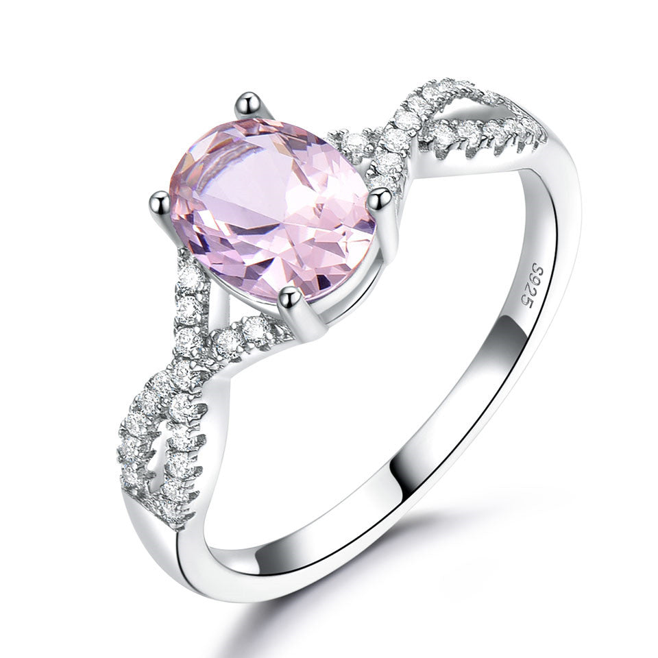 Sterling silver ladies ring with oval pink Morganite and pavé diamonds on a split-shank band
