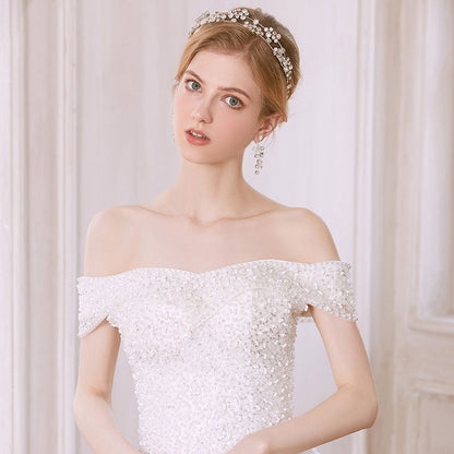 Bridal hair accessories set with clear crystal headpiece and matching drop earrings