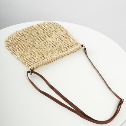 Niche Design vacation straw tote bag with natural woven straw and brown leather strap
