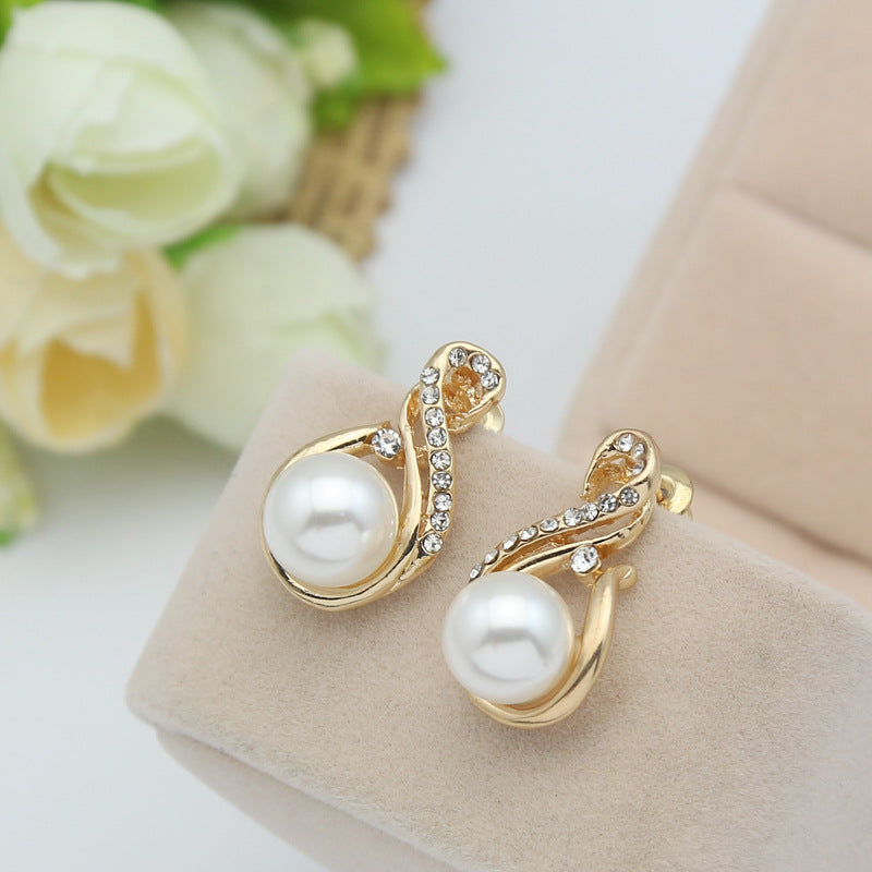Pearl necklace and earrings set in gold-tone with crystal accents