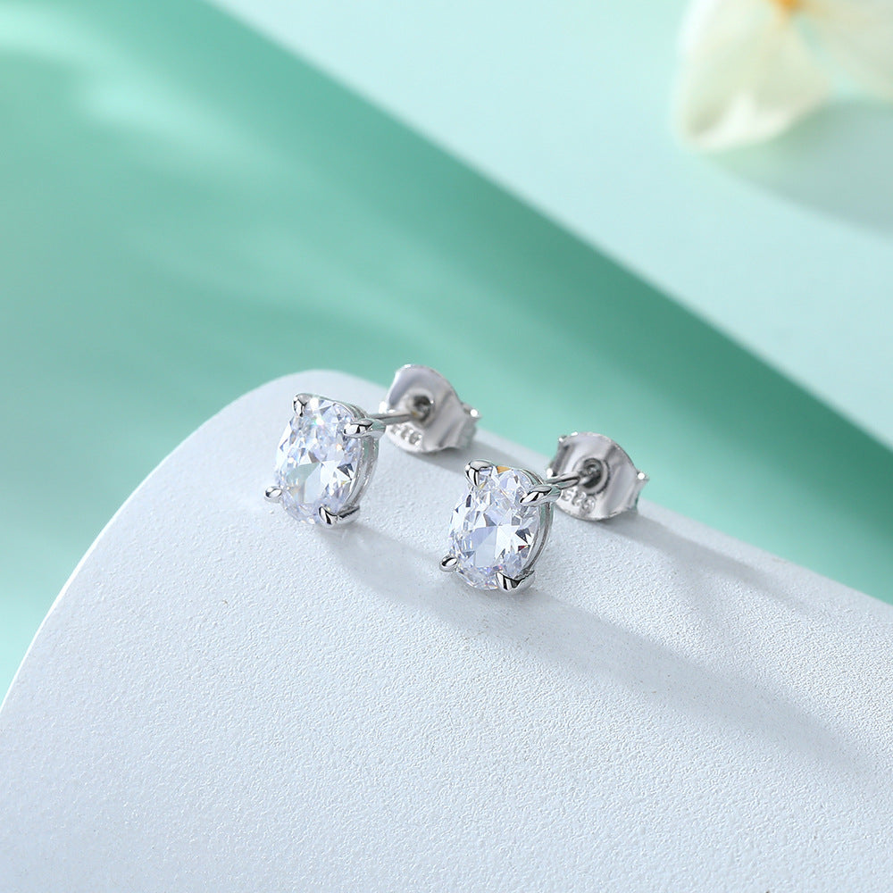 Oval Gem Stud Earrings by cj, silver metal with clear oval-cut gemstones