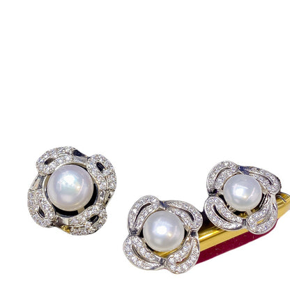 Bridal necklace set by cj; three-piece flower-shaped pearl jewelry with pavé diamonds