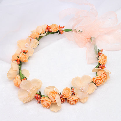 Bridal floral hair wreath in peach with roses, ribbon bow and bead accents by CJ