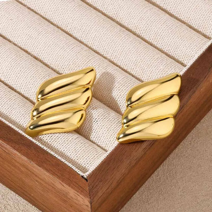 Gold plated stainless steel spiral stud earrings with vintage design, featuring a sleek and stylish look by Edenista.