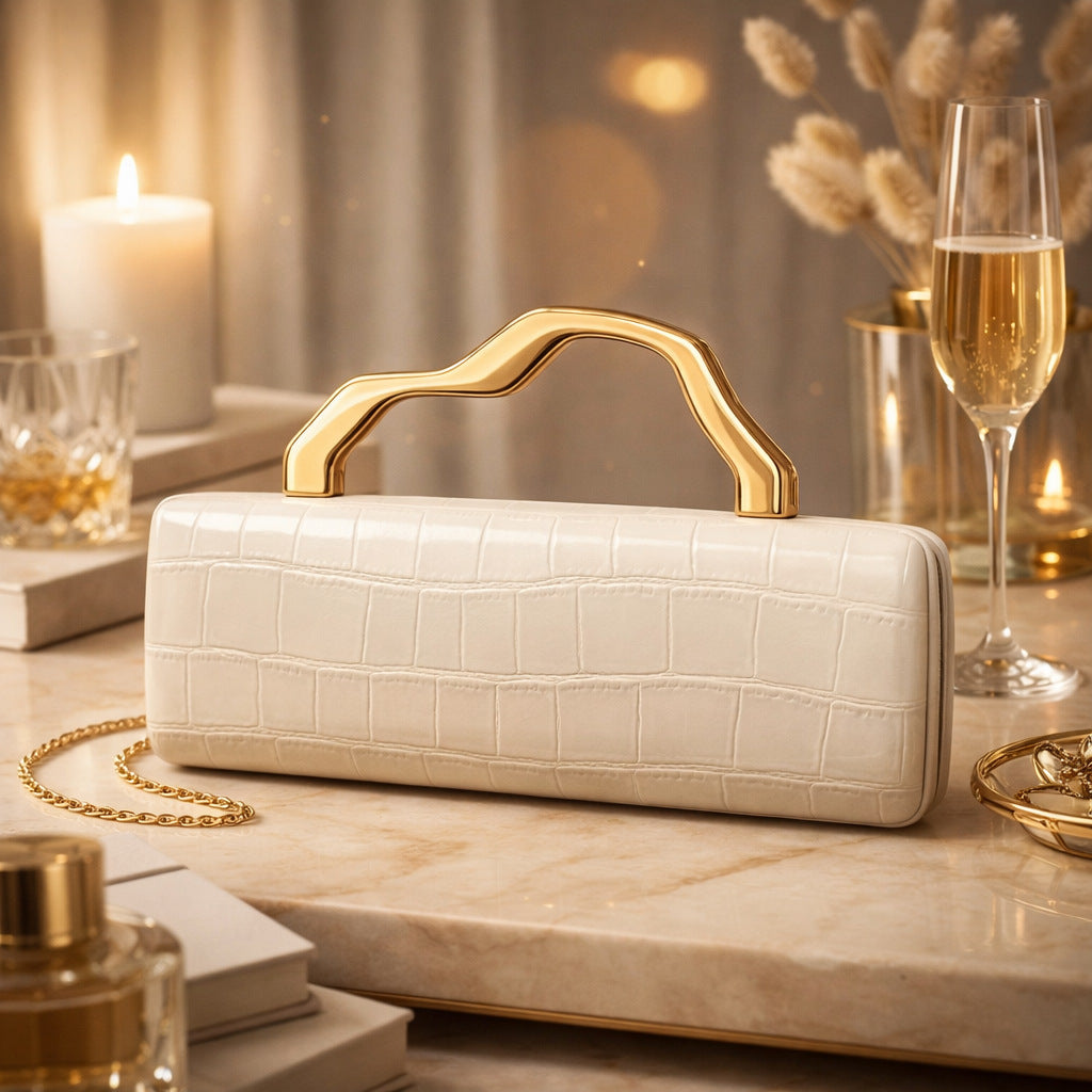 Crocodile-pattern PU evening clutch in ivory with gilded curved handle and gold chain strap