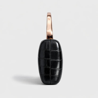 Black crocodile-pattern PU evening clutch with a rose-gold curved handle.