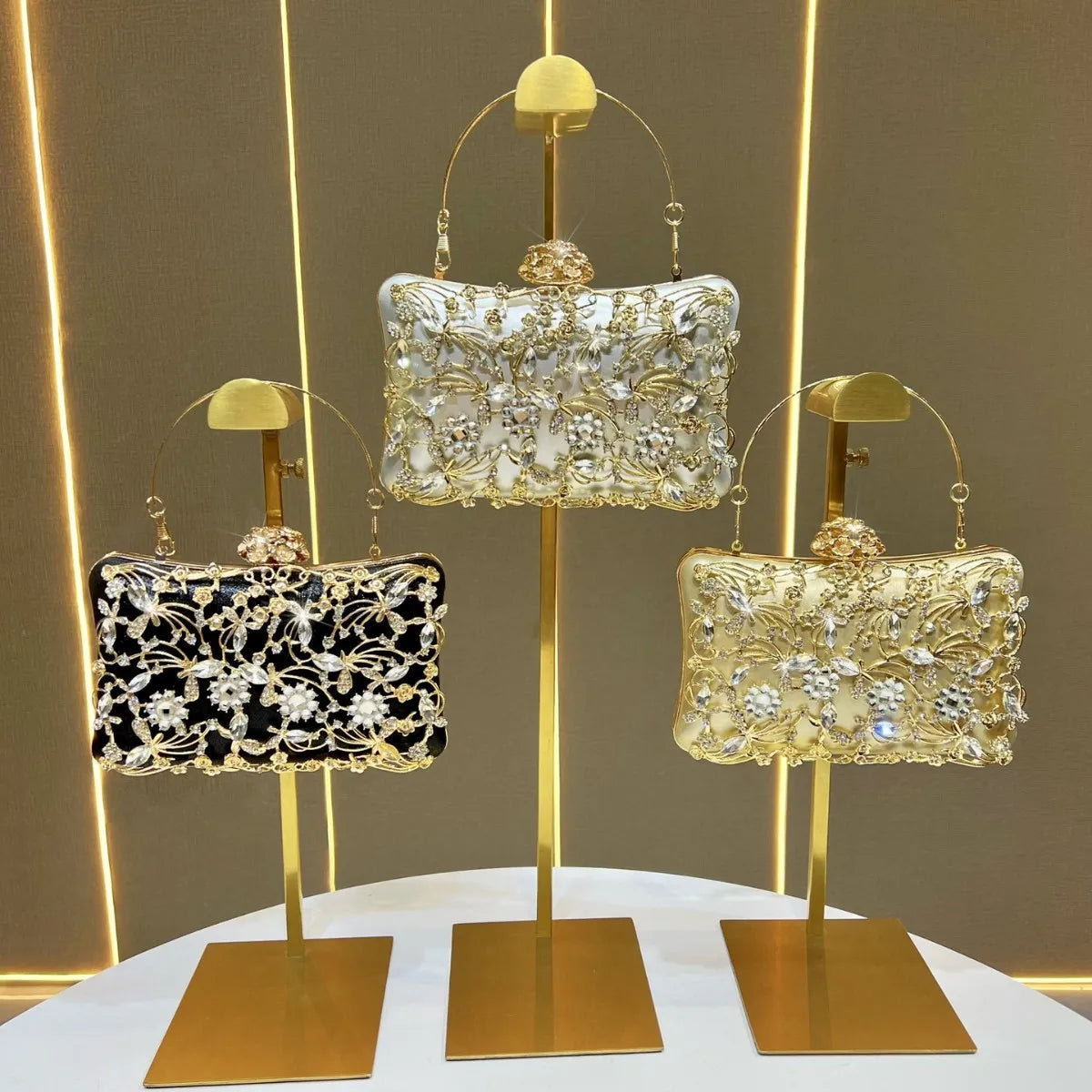Edenista banquet bags set of 3 with floral crystal embroidery in black, white, and champagne.