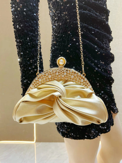 Edenista gold-tone crystal-embellished clutch with pearl clasp, chain strap and satin bow detail