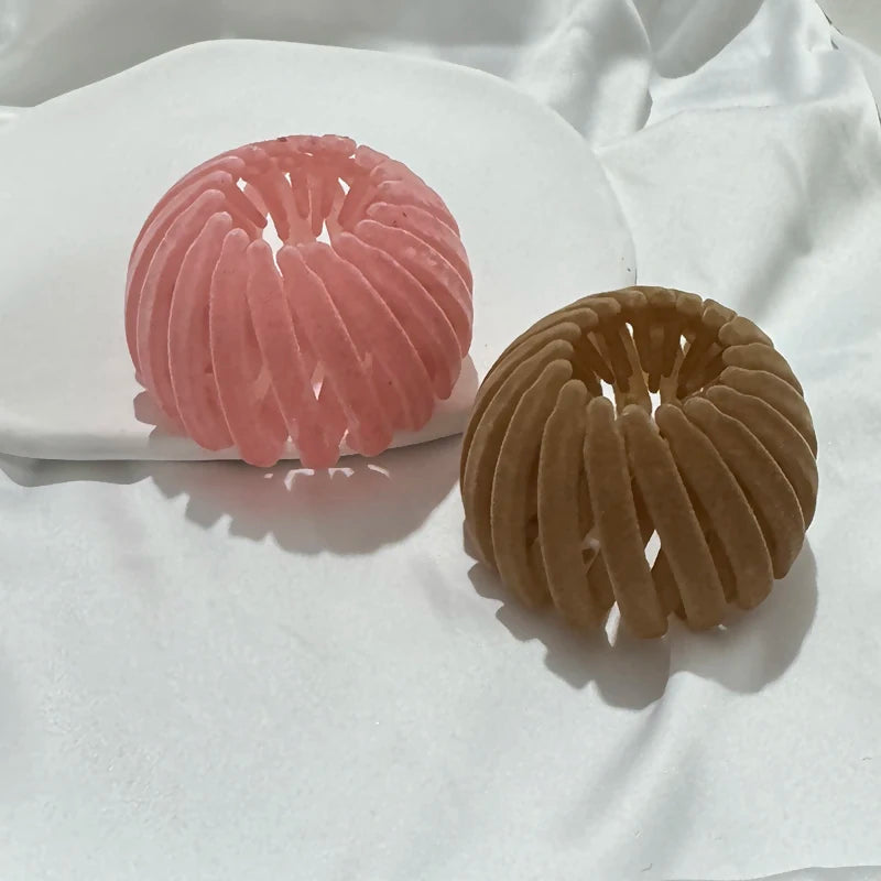 Two round velvet bun hair clips in pink and brown, bird-nest expanding ponytail accessories