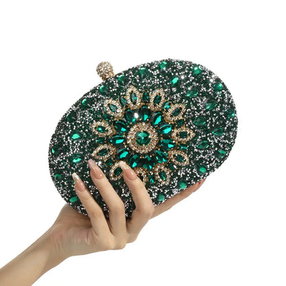 Emerald-green crystal-embellished evening clutch with a bejeweled gold-tone floral centerpiece
