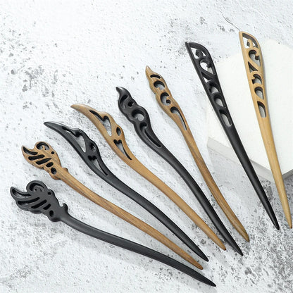 Chinese ethnic style wooden hair sticks set in black and natural wood tones with decorative cutout tops.