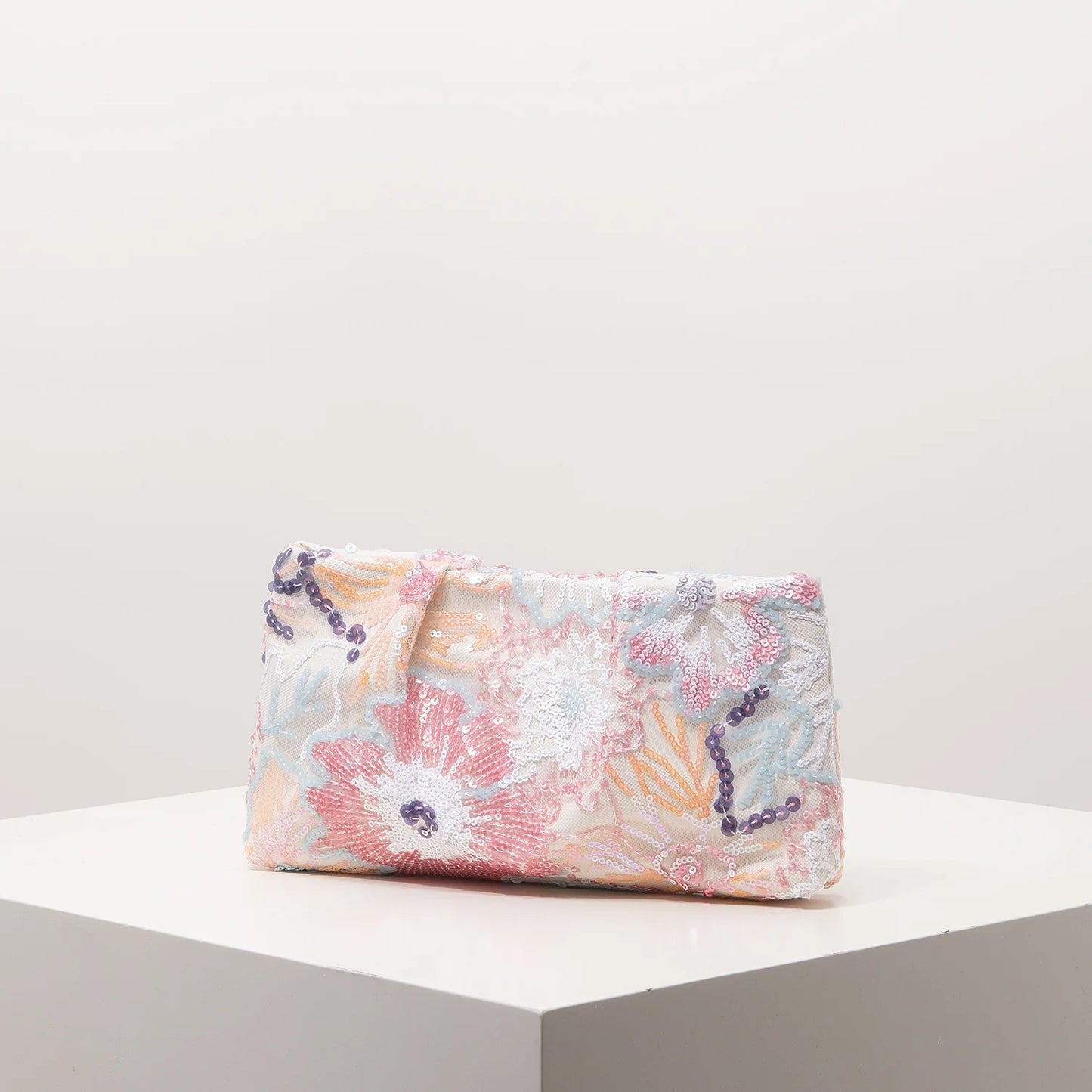 Clutch bag by Edenista with pastel sequin floral embroidery and purple bead trim
