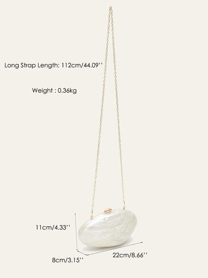 Edenista shell-shaped acrylic clutch with gold chain; solid white finish, elegant evening bag