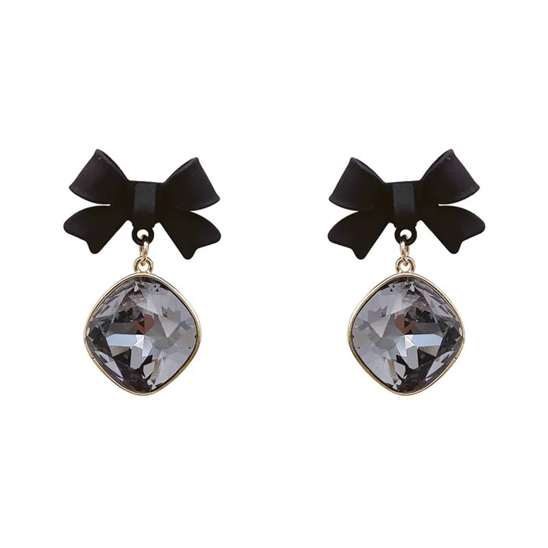 Elegant black bow-tie drop earrings, pair with clear grey cushion-cut gemstones, gold-tone alloy setting