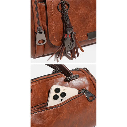 Edenista women's brown leather
Edenista women's brown leather crossbody bag with tassel charm