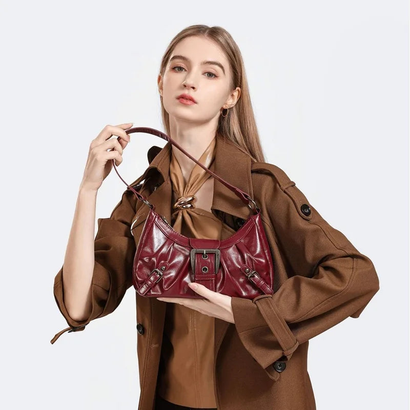 Red pleated hobo handbag by Edenista with shoulder strap and buckle detail