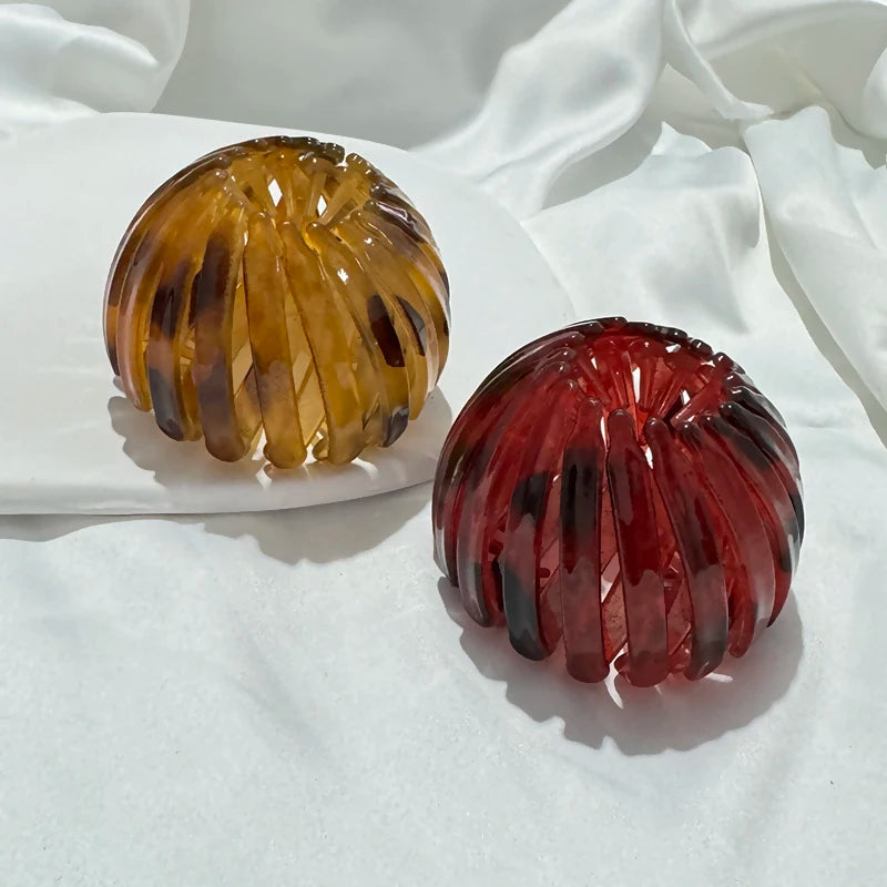 Edenista 2-pack hair claw clips; round bird-nest bun clips in amber and red translucent resin