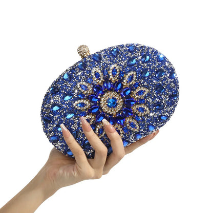 Evening clutch with blue crystal embellishments and gold-tone accents
