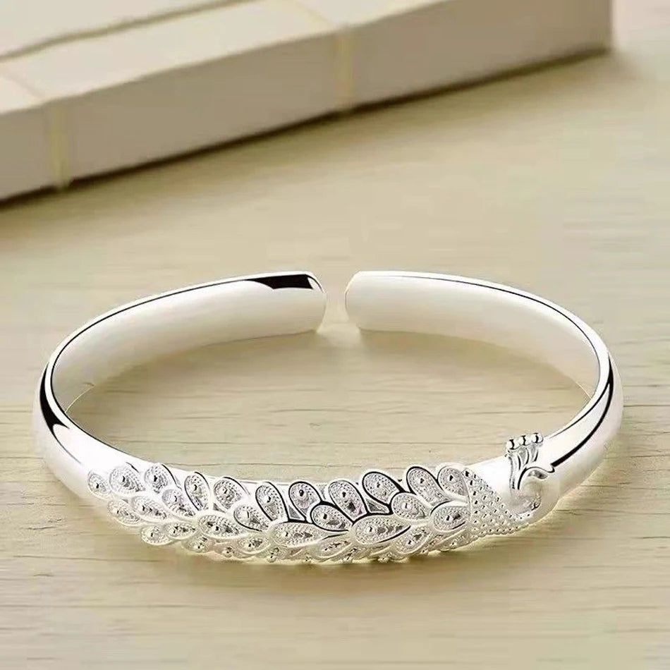 Peacock feather open-screen bracelet by Edenista, 925 sterling silver bangle for women