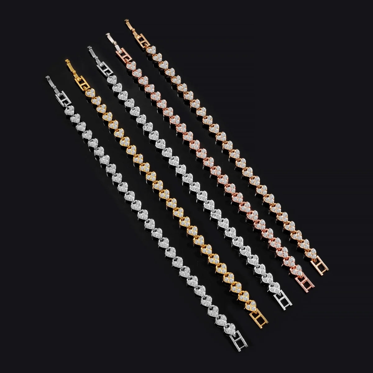Roman imitation crystal geometric chain bracelets set by Edenista; seven pieces in silver, gold, and rose gold tones