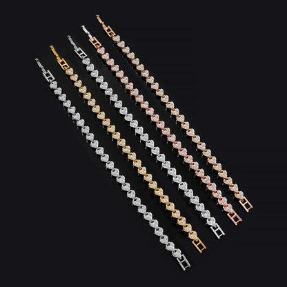 Roman imitation crystal geometric chain bracelets set by Edenista; seven pieces in silver, gold, and rose gold tones