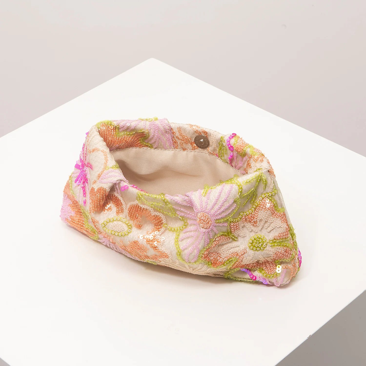 Clutch bag with pastel floral embroidery and sequin accents