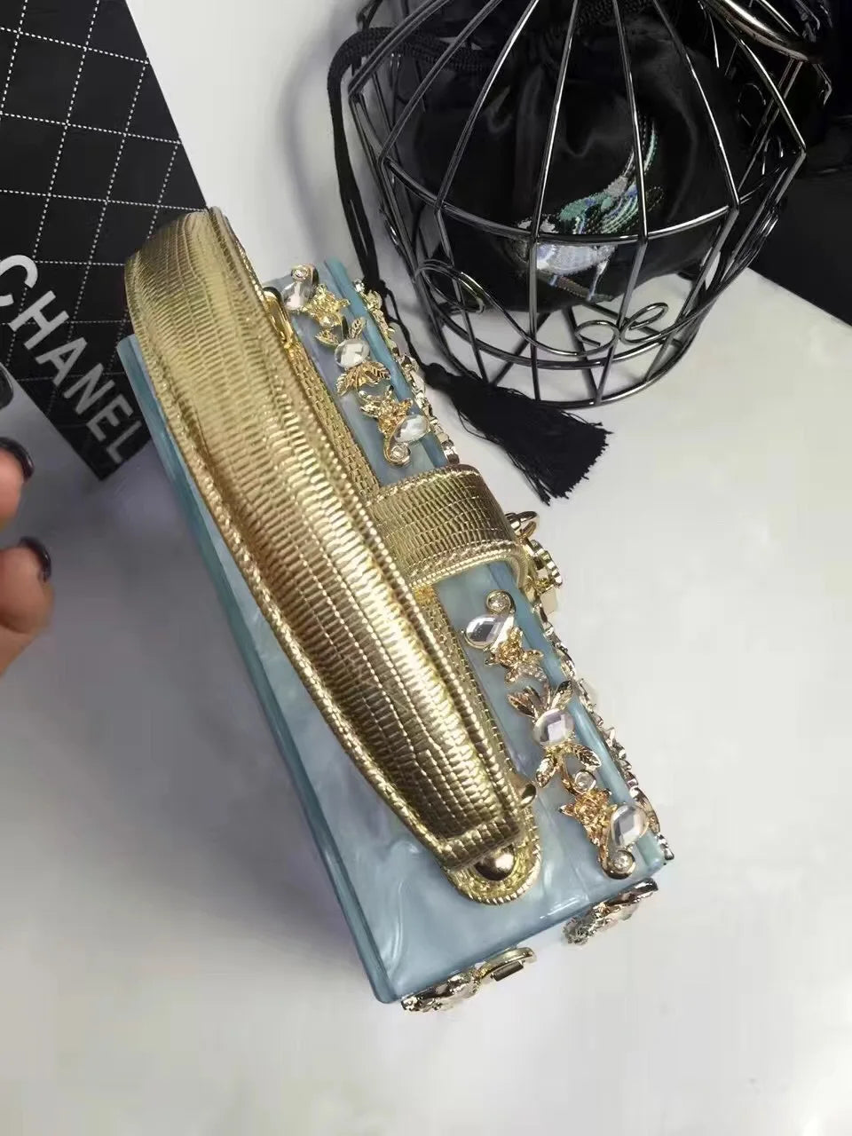Edenista high-grade acrylic evening bag; gold textured clutch with rhinestone floral strap.