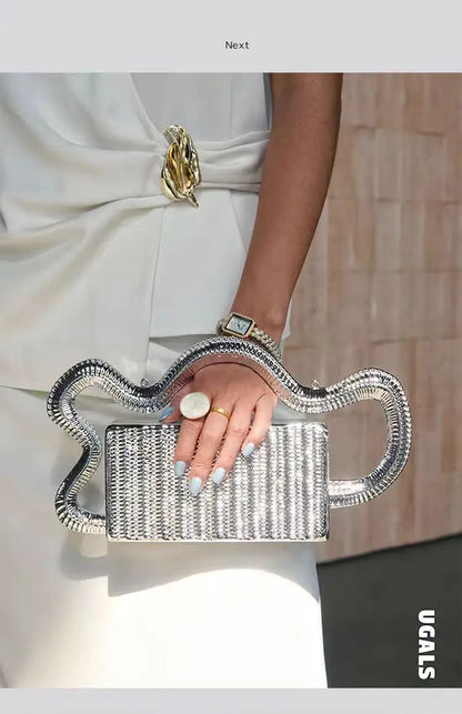 Silver Edenista beaded clutch purse with rhinestone snake-shaped handle