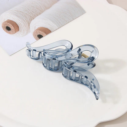Hair claw clips set of 3 in translucent blue acrylic with geometric design.