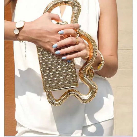 Gold rhinestone clutch purse with curved snake-like strap for women