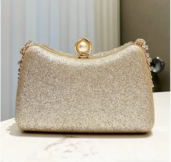Evening clutch with gold glitter finish, pearl clasp and rhinestone trim, retro luxury party bag