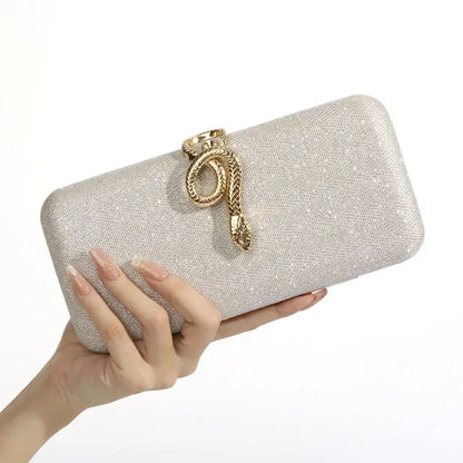 Edenista Classic Snake Buckle evening clutch in glitter beige with a gold snake clasp