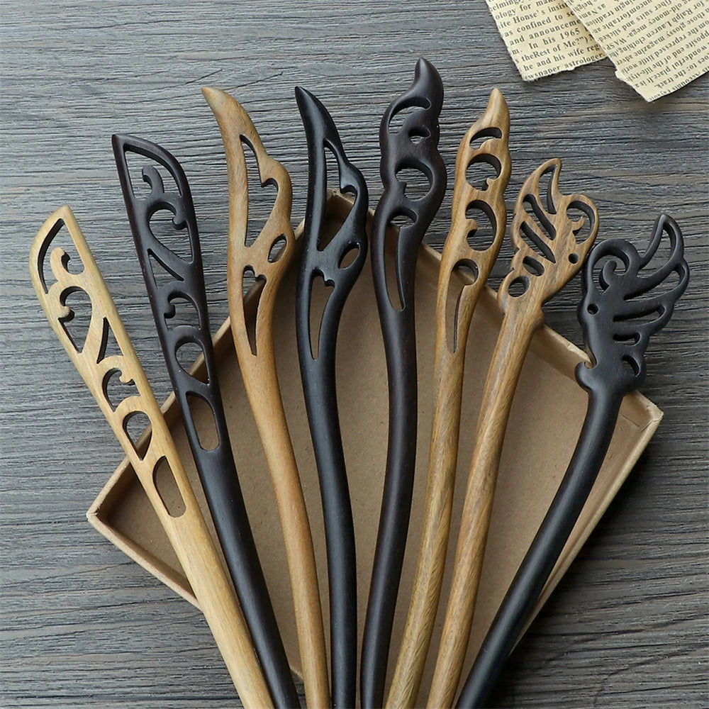 Chinese ethnic style hair sticks with carved cutouts in black and natural wood tones