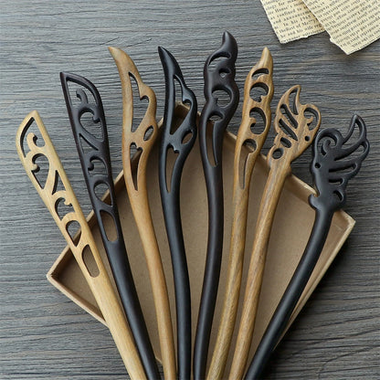 Chinese ethnic style hair sticks with carved cutouts in black and natural wood tones