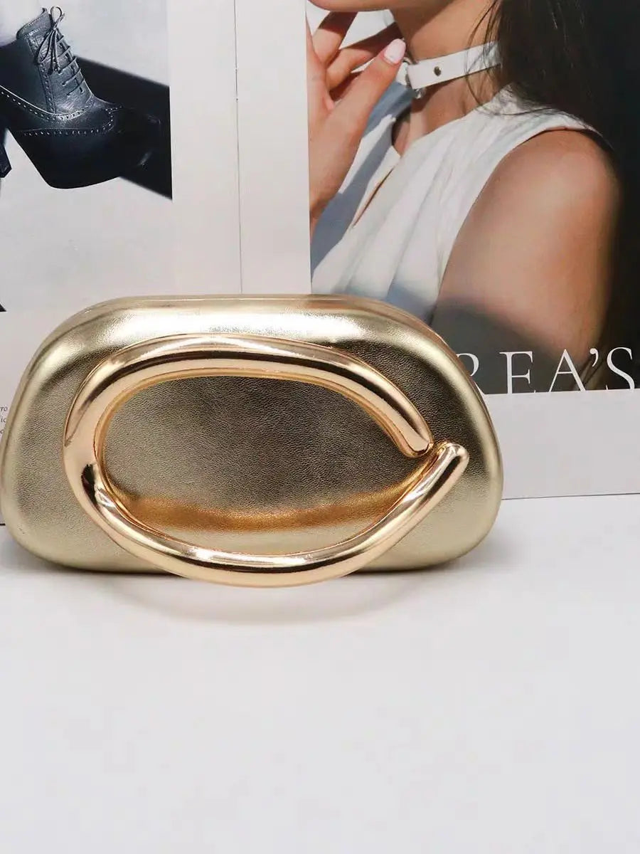 Gold-tone metal box clutch bag with curved circular handle by Edenista