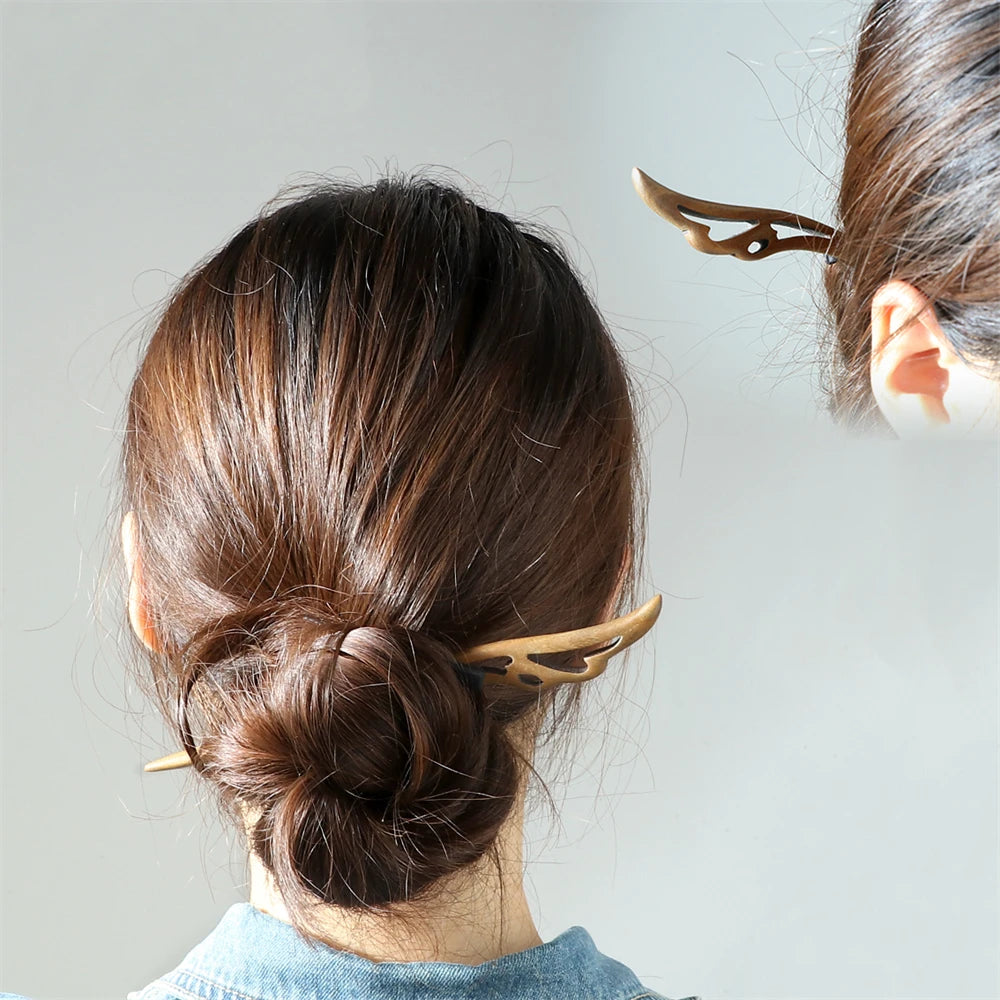 Chinese ethnic style hair sticks in warm sandalwood brown, two-piece set securing a bun