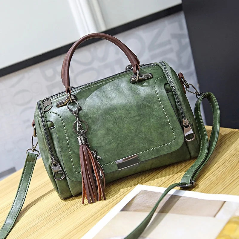 Women green retro shoulder bag with brown top handle, tassel charm and crossbody strap