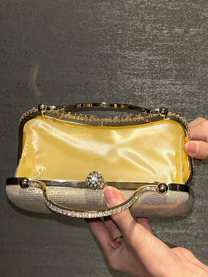 Diamond evening clutch with gold metallic frame, crystal rhinestones, and satin interior