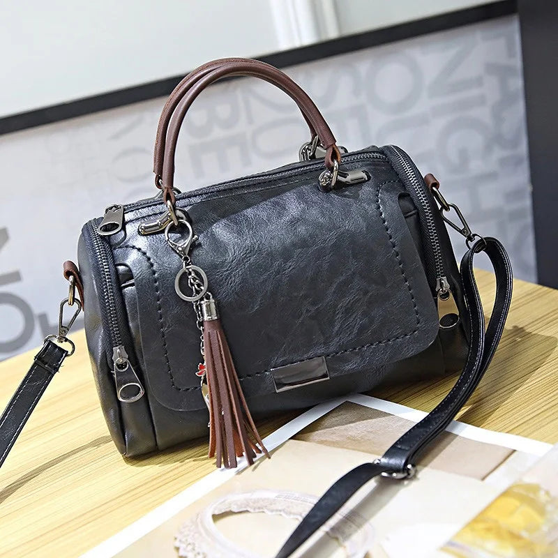 Women solid-color retro shoulder bag with floral pendant, tassel decor, brown
Women retro shoulder bag in black with brown handles, floral tassel pendant, crossbody strap.