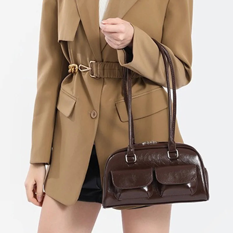 Edenista women brown leather bowling bag with two front pockets and dual top handles