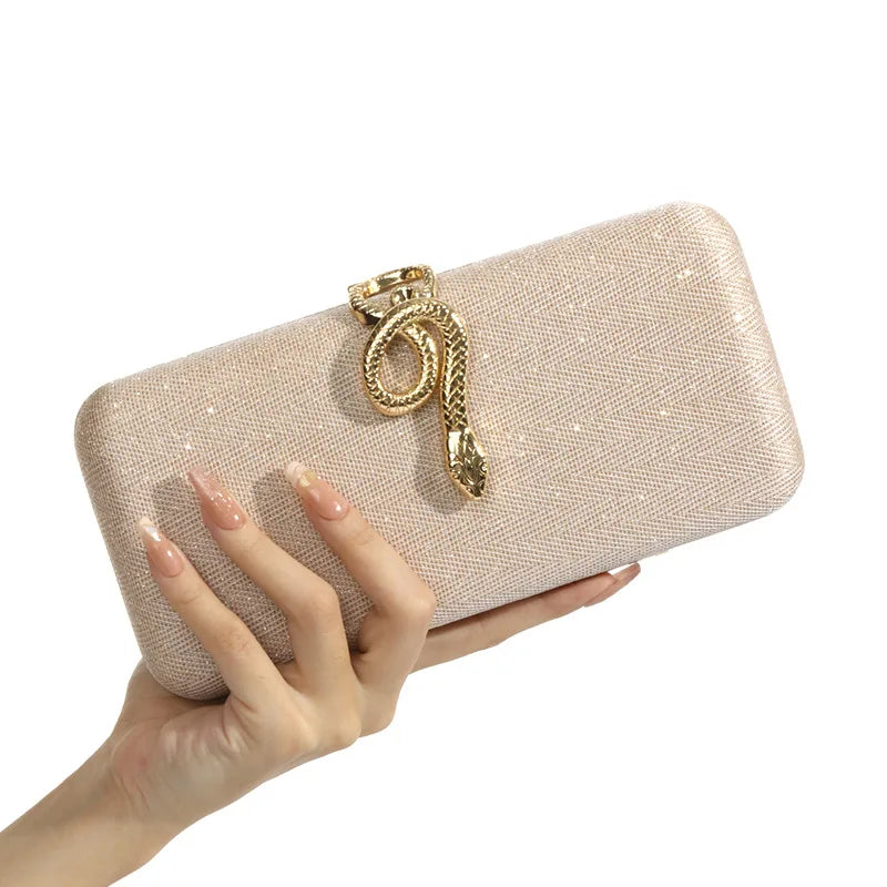 Edenista classic snake-buckle evening purse; beige glitter clutch with gold snake ornament
