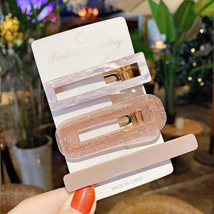 2-piece acrylic hair clip set with pink glitter geometric shapes for women