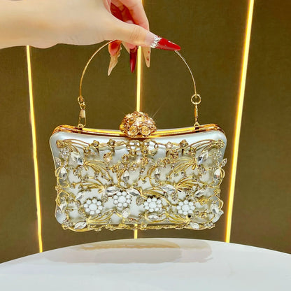 Banquet clutch bag with white enamel and gold-tone metal, ornate crystal floral embellishments and gold chain strap