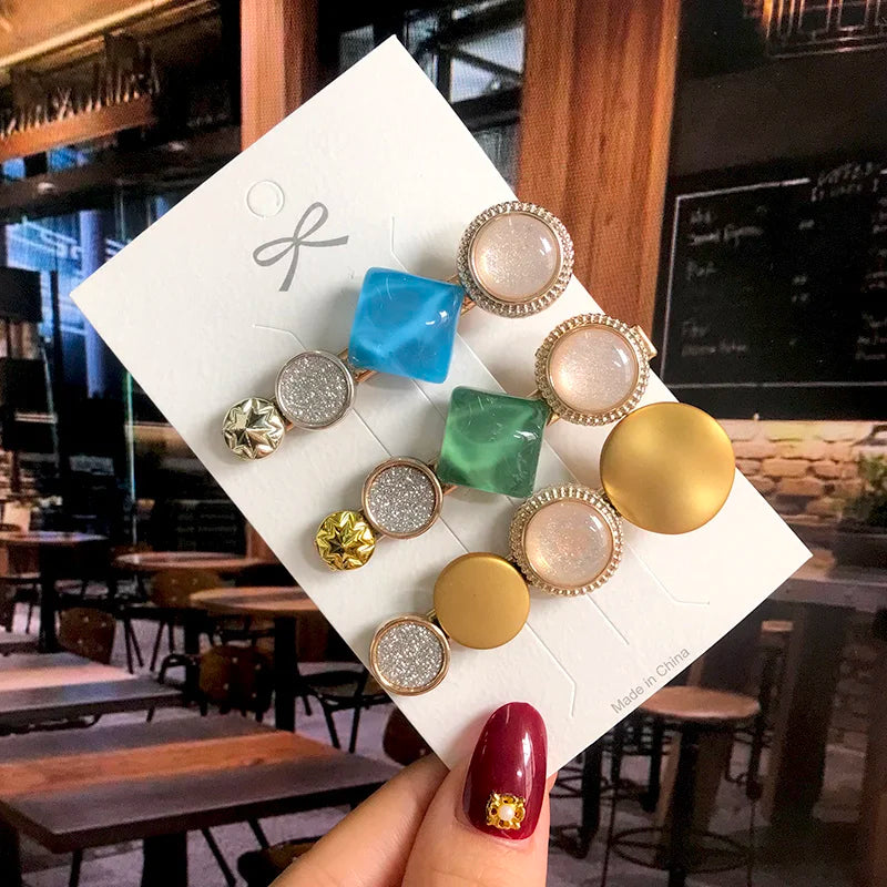 Geometric acrylic pearl hair clips set by Edenista; 9 assorted square, round and glitter barrettes