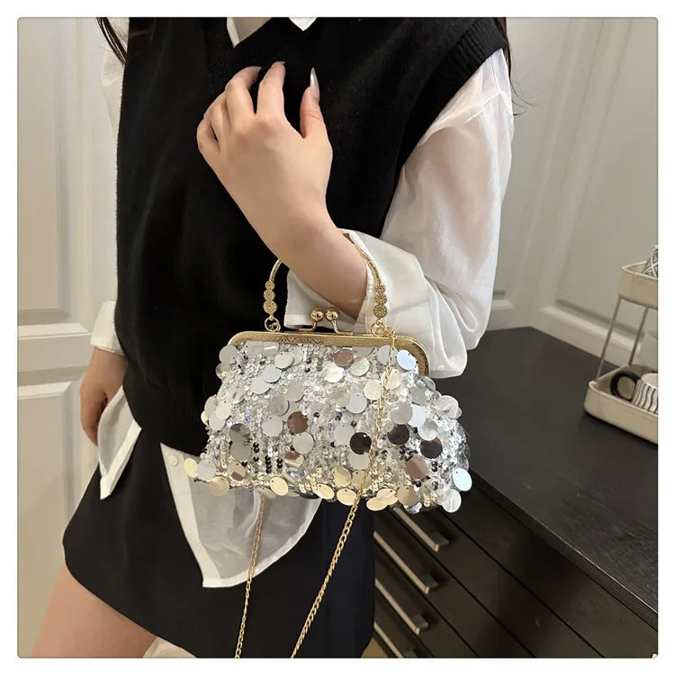 Sequined evening shoulder bag with gold-tone frame and chain, silver reflective discs.