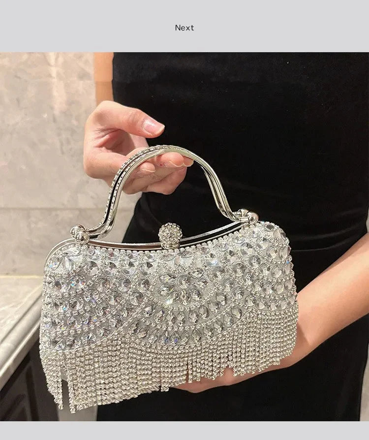 Edenista Diamond evening clutch bag; silver rhinestone handbag with metallic handle and crystal fringe.
