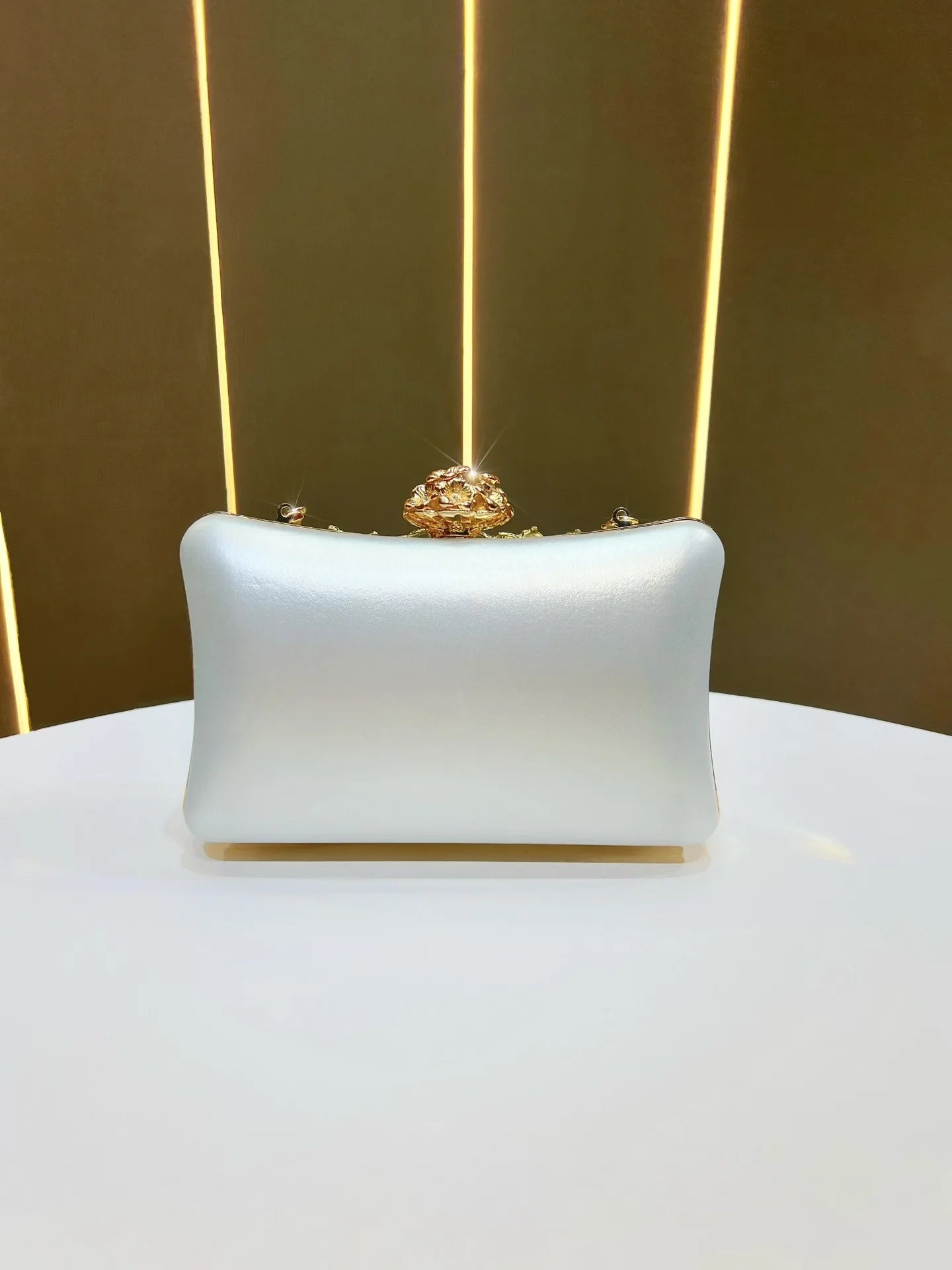 Banquet clutch in pale blue satin with ornate gold crystal-top clasp